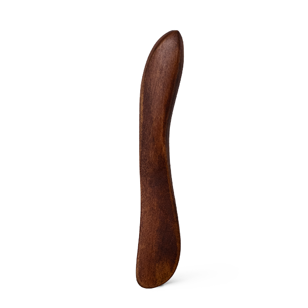 Wooden spatula on a white background