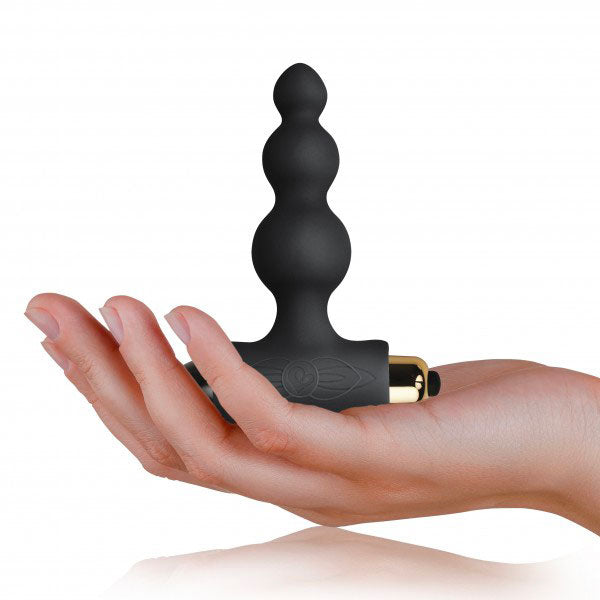 hand holding Black Bubbles Petite Sensations Butt Plug on white background. image 3