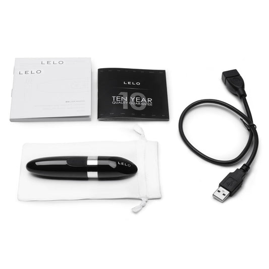 Black Luxury Rechargeable Vibrator with charger on white background. image 2