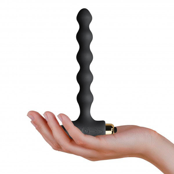 hand holding Black Pearls Petite Sensations Butt Plug on white background. image 3
