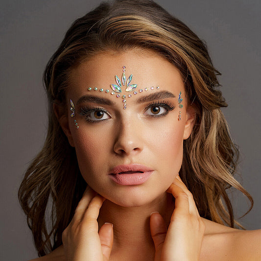 girl wearing the bling stickers on her eyes with a grey background. image 1