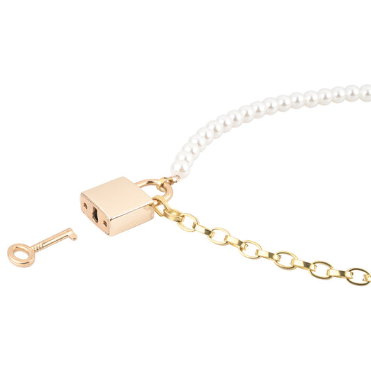 Gold and pearly day necklace on white background with lock and key. image 2