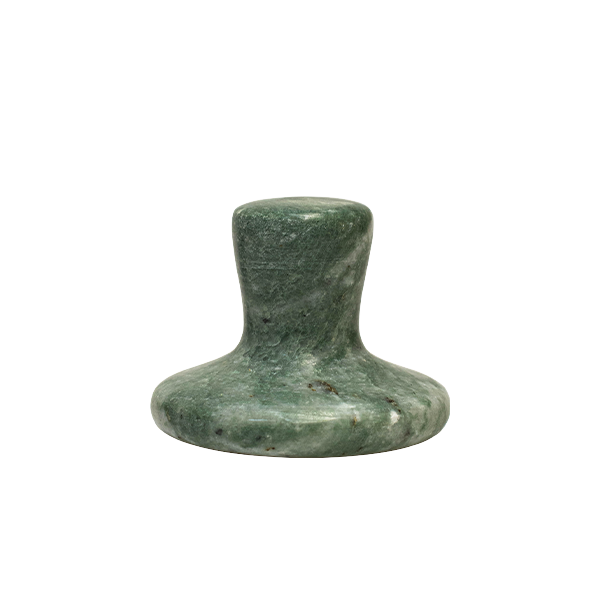 Green stone object on a white background