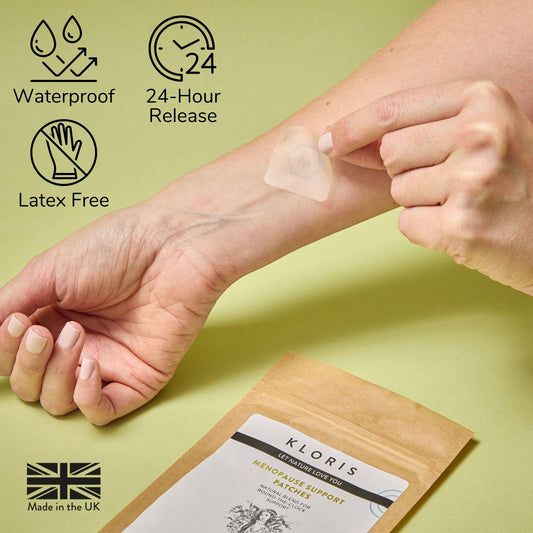 Person applying a patch on their arm with product packaging and features displayed.
