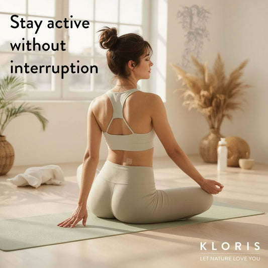 Woman in white athletic wear sitting on a yoga mat with text 'Stay active without interruption' and brand name 'KLORIS'.