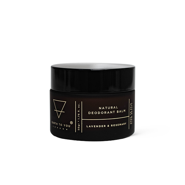 Black jar of natural deodorant balm with branding on a white background