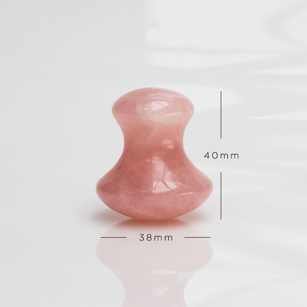 Pink stone with measurements on a white background
