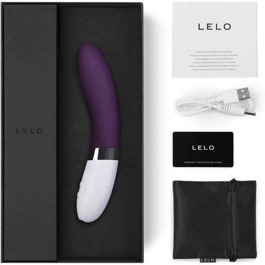 Plum G-Spot Vibrator with packaging and charger on white background. image 2