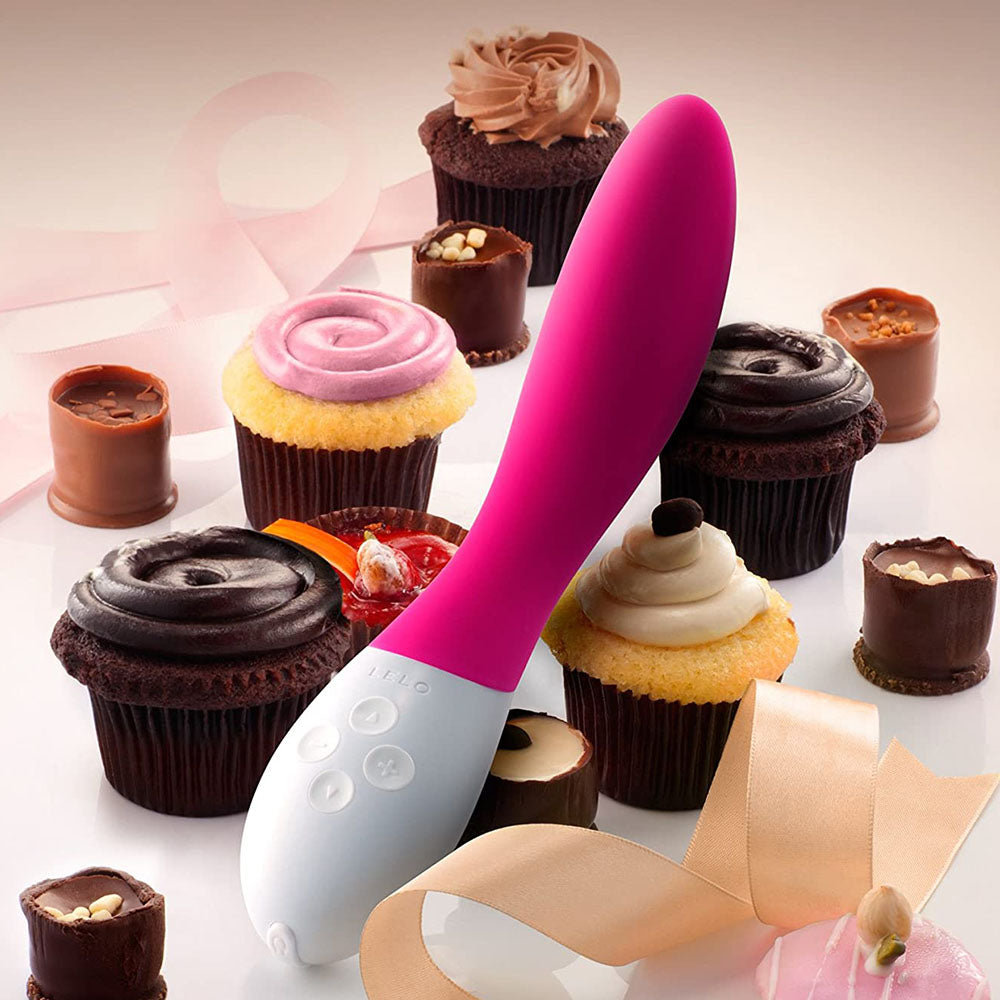 Purple G-Spot Massager with cupcakes and ribbon on pale background. image 3