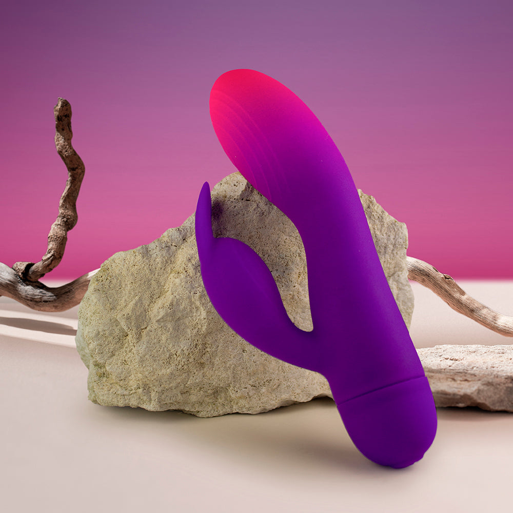 Rocks off Purple GloGirl Rabbit Vibrator on rocks, sand and twigs. image 3