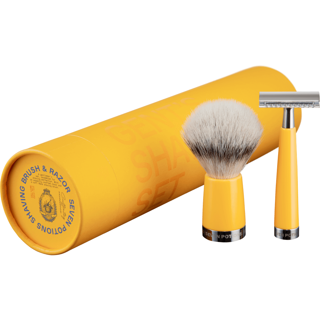 Yellow shaving brush and razor set with a cylindrical yellow container on a black background
