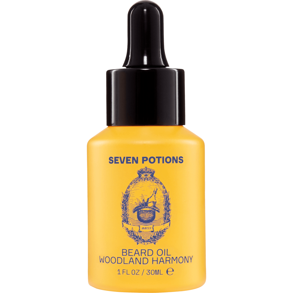 Yellow bottle of Seven Potions Woodland Harmony beard oil on a clear background