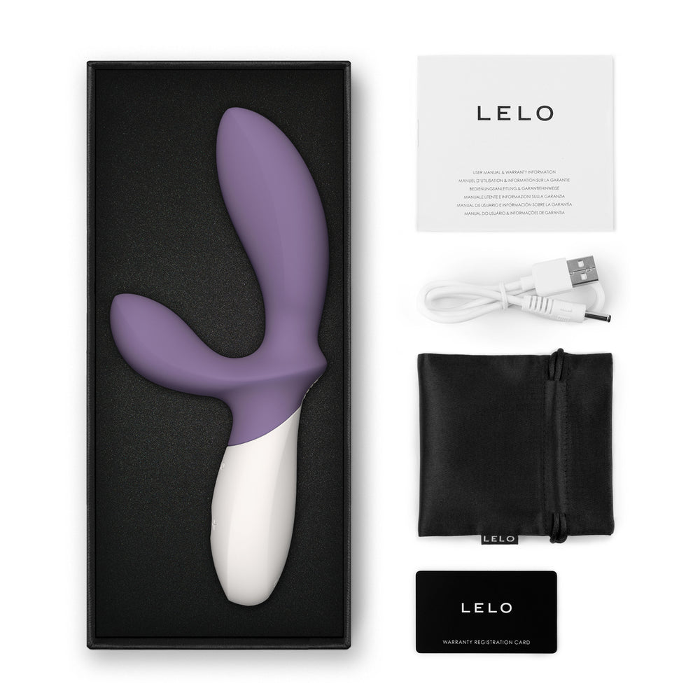 Violet Dust Loki Wave 2 Prostate Massager with charger and bag on white background. image 3