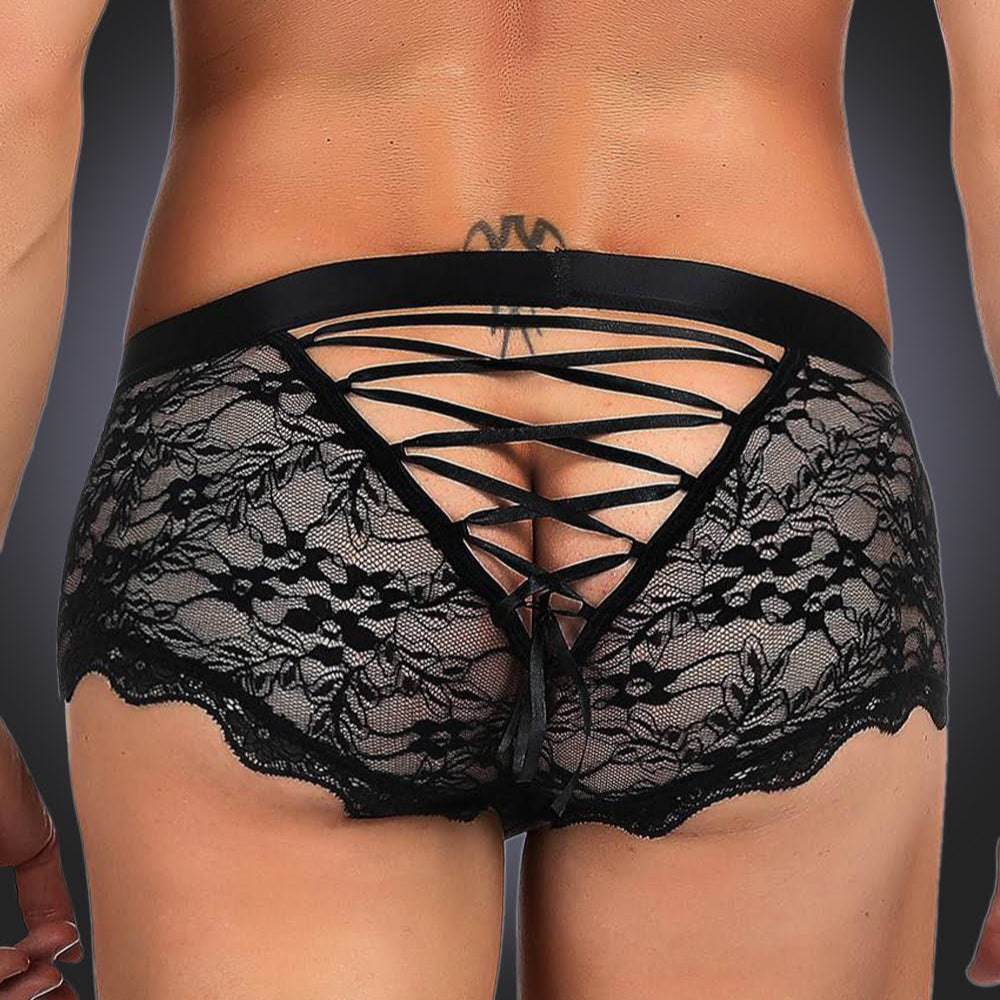 Man wearing black lace boxer on grey background. image 2