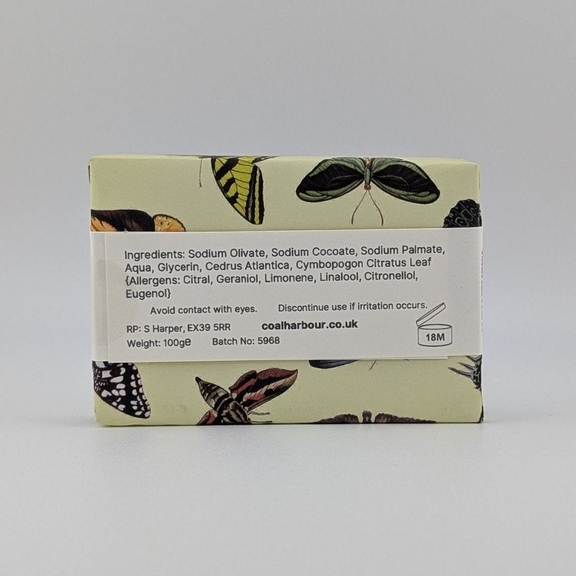 Bar of soap with butterfly design on a white background