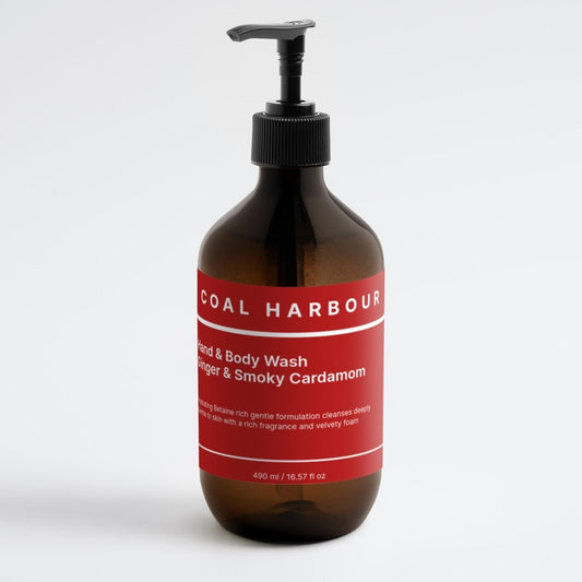 Bottle of Coal Harbour hand and body wash with a red label on a white background