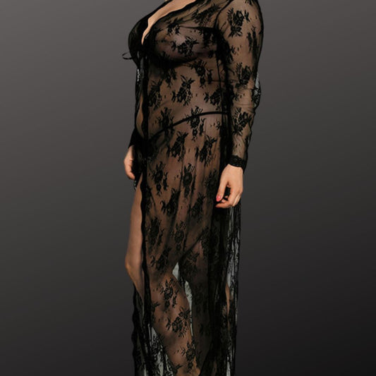 lady wearing lace robe with black pant on grey background.