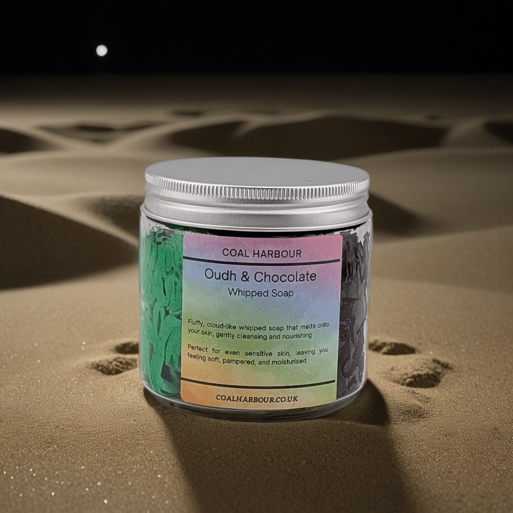 Jar of Coal Harbour Oudh & Chocolate Whipped Soap on sand with moonlit sky