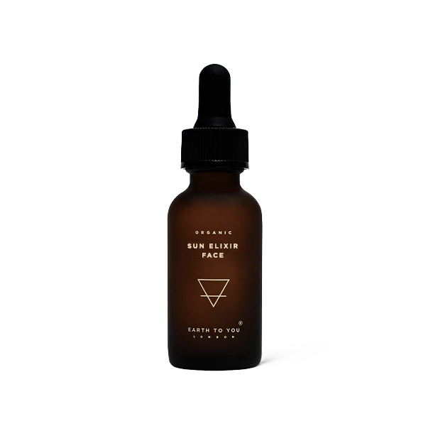Brown glass bottle with dropper labeled 'Sun Elixir Face' on a white background