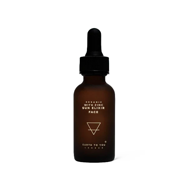 Brown glass bottle with dropper labeled 'Earth to You' on a white background