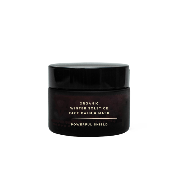 Black jar of Organic Winter Solstice Face Balm & Mask on a white background