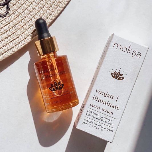 Box, bottle of serum and a hat on a table.