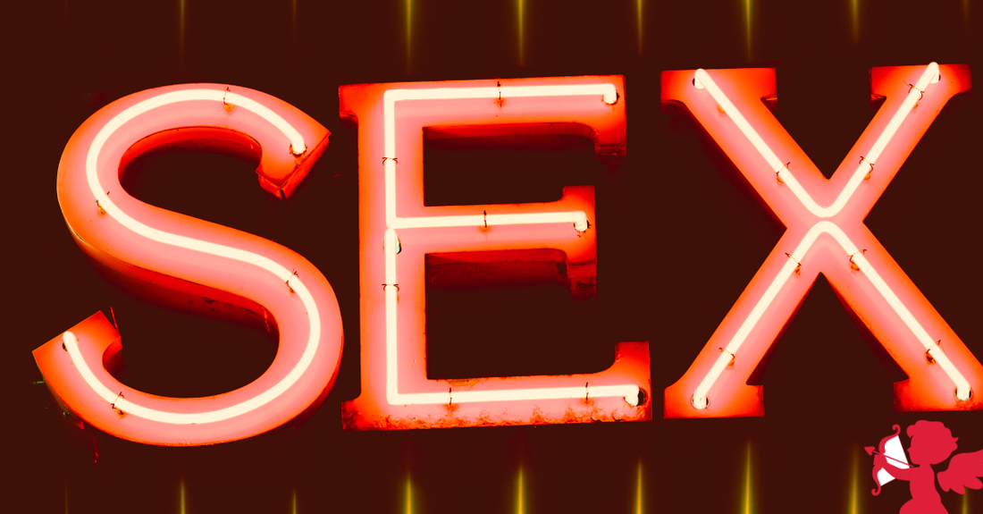 neon light with the word sex and a cupid