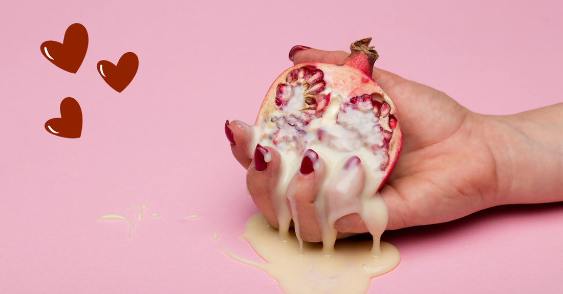 a ladies hand with granite fruit and cream and some love hearts