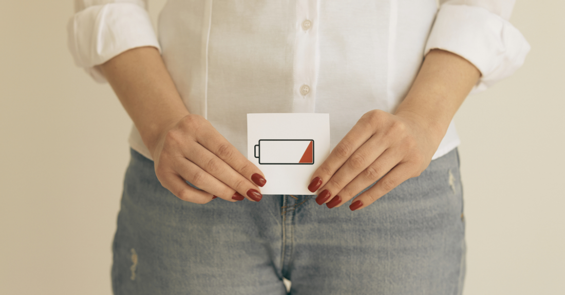 lady holding up a low battery sign