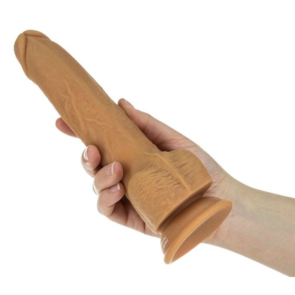 hand holding Flesh Brown Thrusting Dildo on white background. image 3