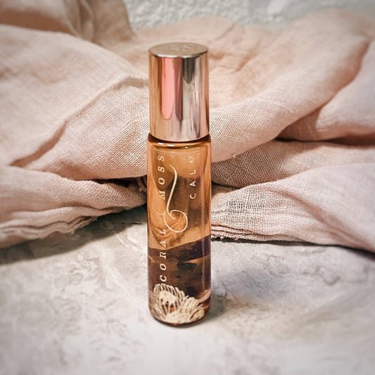 Bottle of Roller sitting on a table with a cloth in the background.