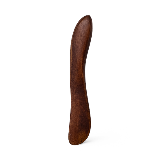 Wooden spatula on a white background
