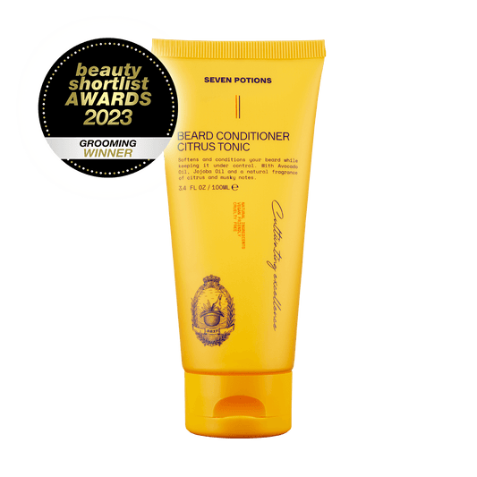 Yellow tube of Seven Potions beard conditioner with a Beauty Shortlist Awards 2023 badge on a black background