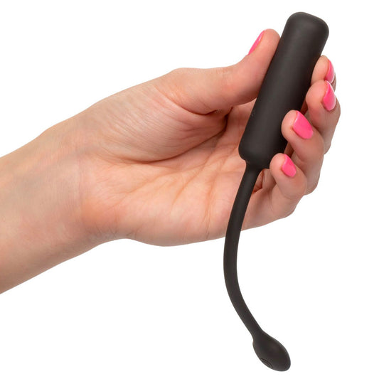 hand holding Black Petite Wristband Remote Bullet on white background. image 2