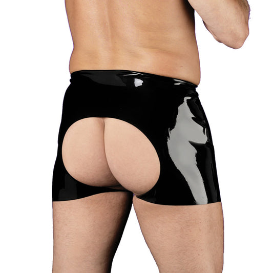 man wearing backless black latex briefs on white background. image 1