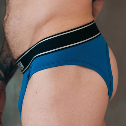 Blue men's underwear with a black waistband on a neutral background
