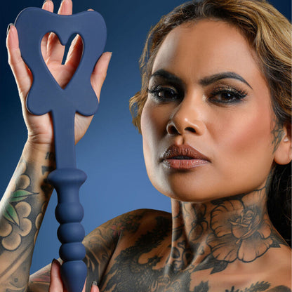 women holding Black Paddle and Plug on blue background. image 2