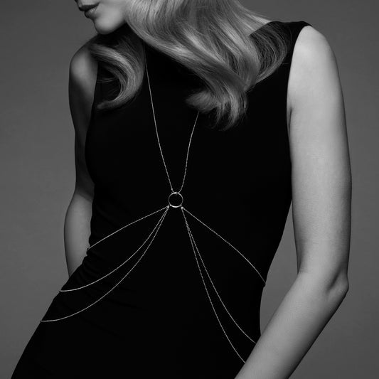 lady wearing a black dress and gold chains on a grey background. image 1