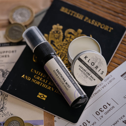 Kloris CBD products including a tinsel and a roll-on bottle on a British passport and money.