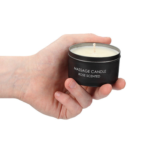 massage candle in hand on white background. image 2