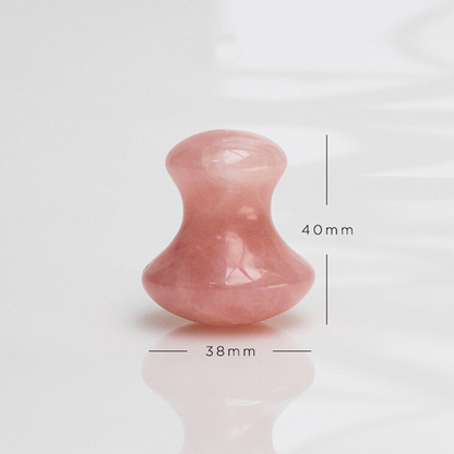 Pink stone with measurements on a white background