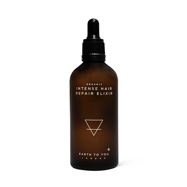Brown bottle of 'Intense Hair Repair Elixir' with dropper on a white background