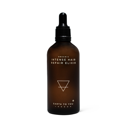 Brown bottle of 'Intense Hair Repair Elixir' with dropper on a white background