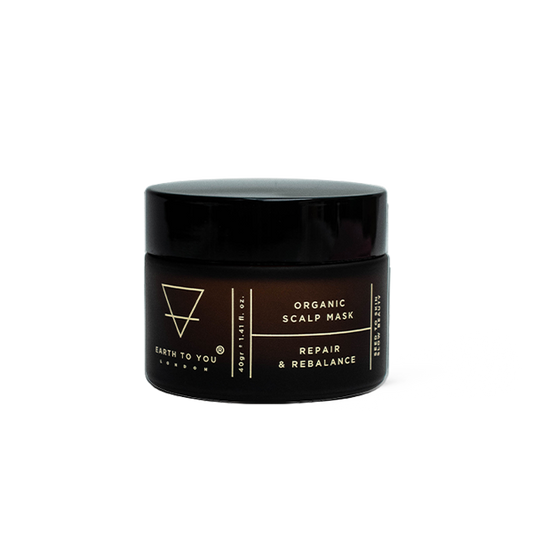 Black jar of organic scalp mask with branding on a white background