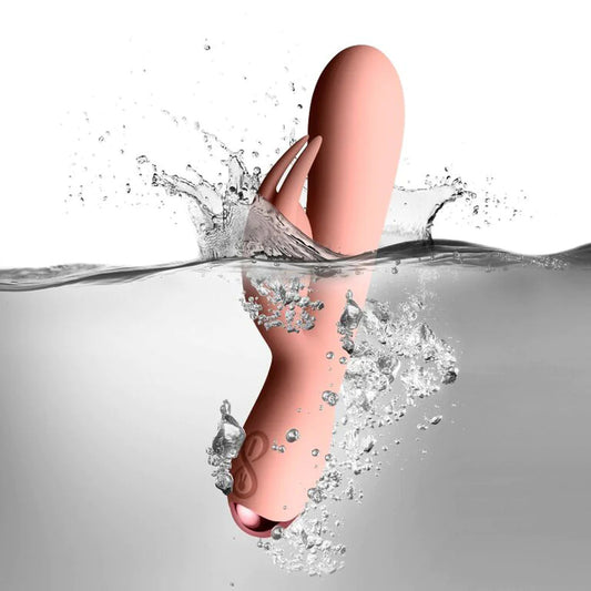rocks off Pink Flutter Rabbit Vibrator on white background and water. image 2