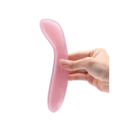 hand holding Rose Quartz Crystal G Wand on white background. image 2