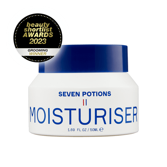 Seven Potions moisturizer jar with a blue lid on a black background, featuring an award badge.