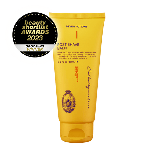 Yellow post-shave balm tube with 'Seven Potions' branding and a Beauty Shortlist Awards 2023 badge on a black background.