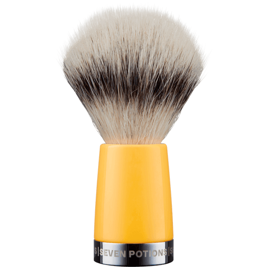Shaving brush with yellow handle and black bristles on a white background
