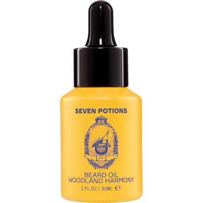 Yellow bottle of Seven Potions Woodland Harmony beard oil on a clear background